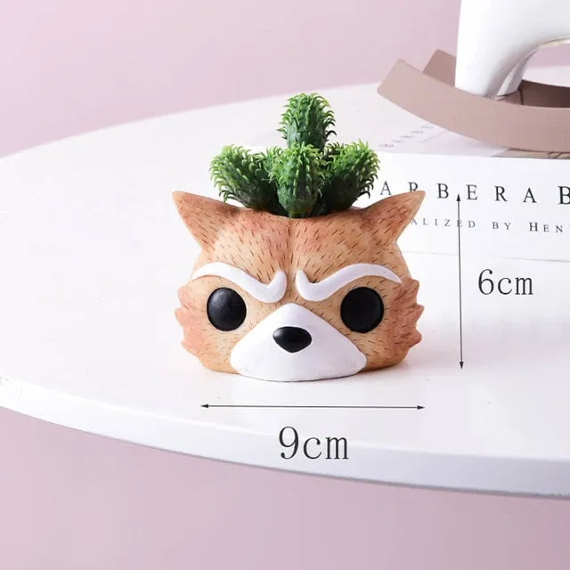 Artificial plants in cute ceramic planters