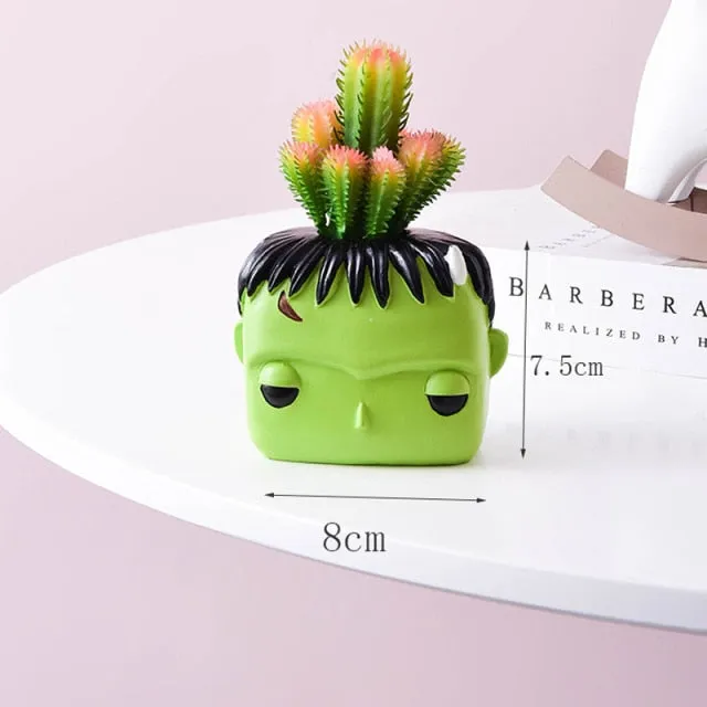 Artificial plants in cute ceramic planters