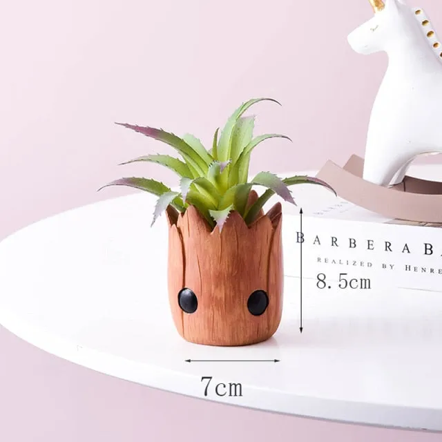 Artificial plants in cute ceramic planters